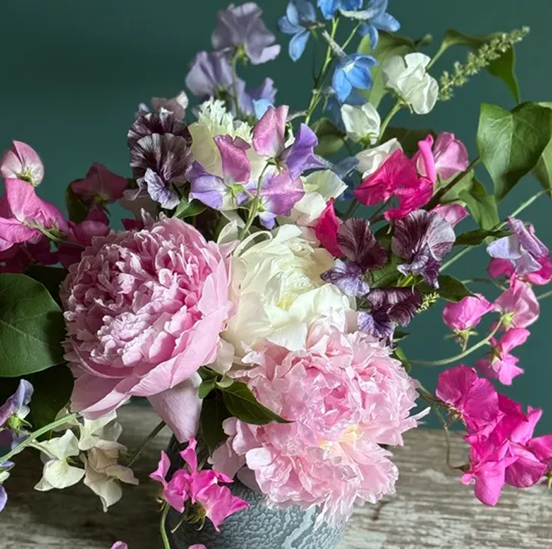 Pink and purple floral arrangement in vase