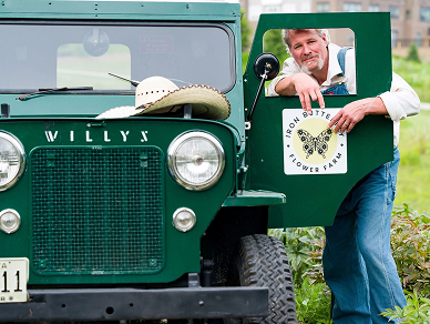 Green truck with farm logo