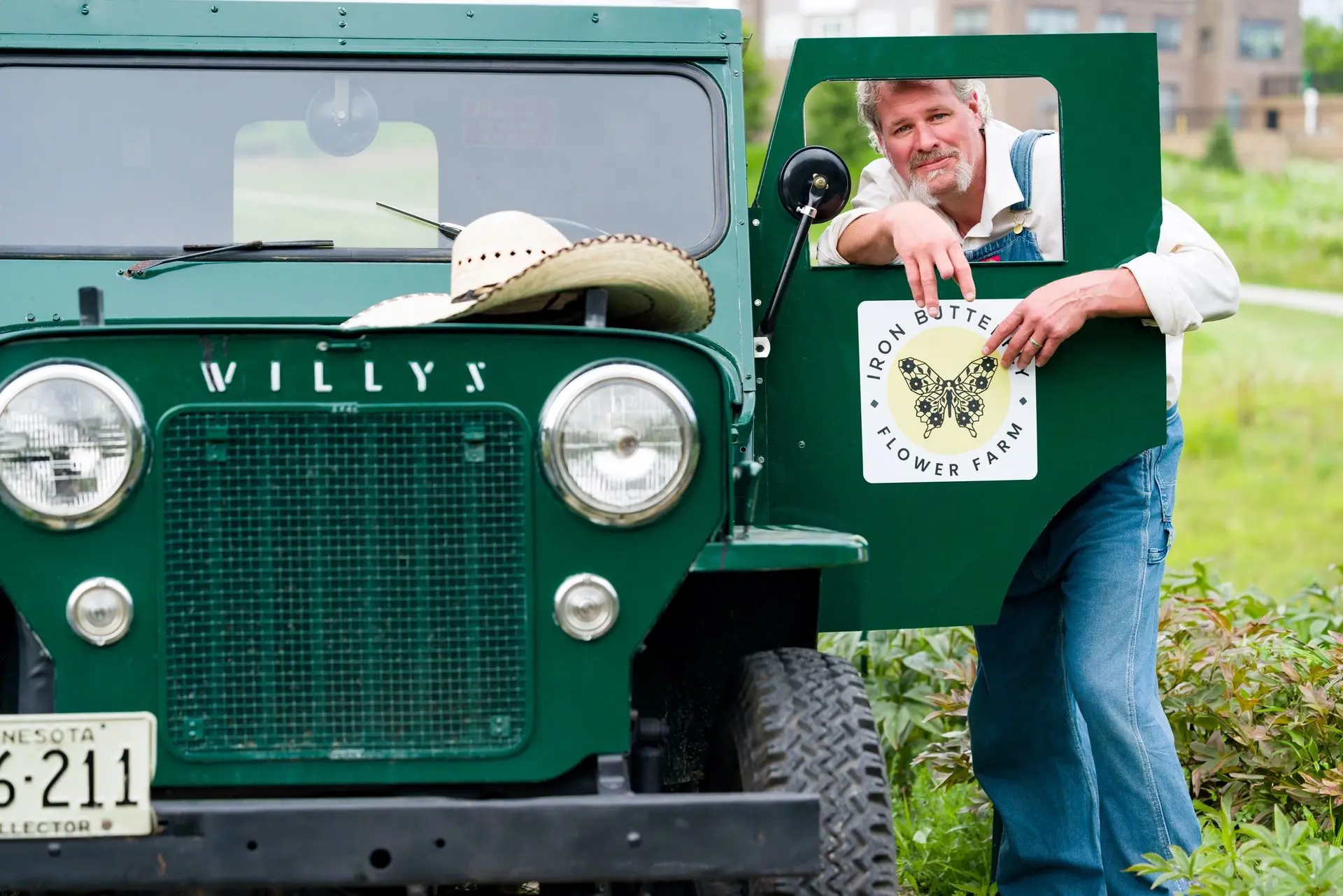 Farmer posing with classic vehicle